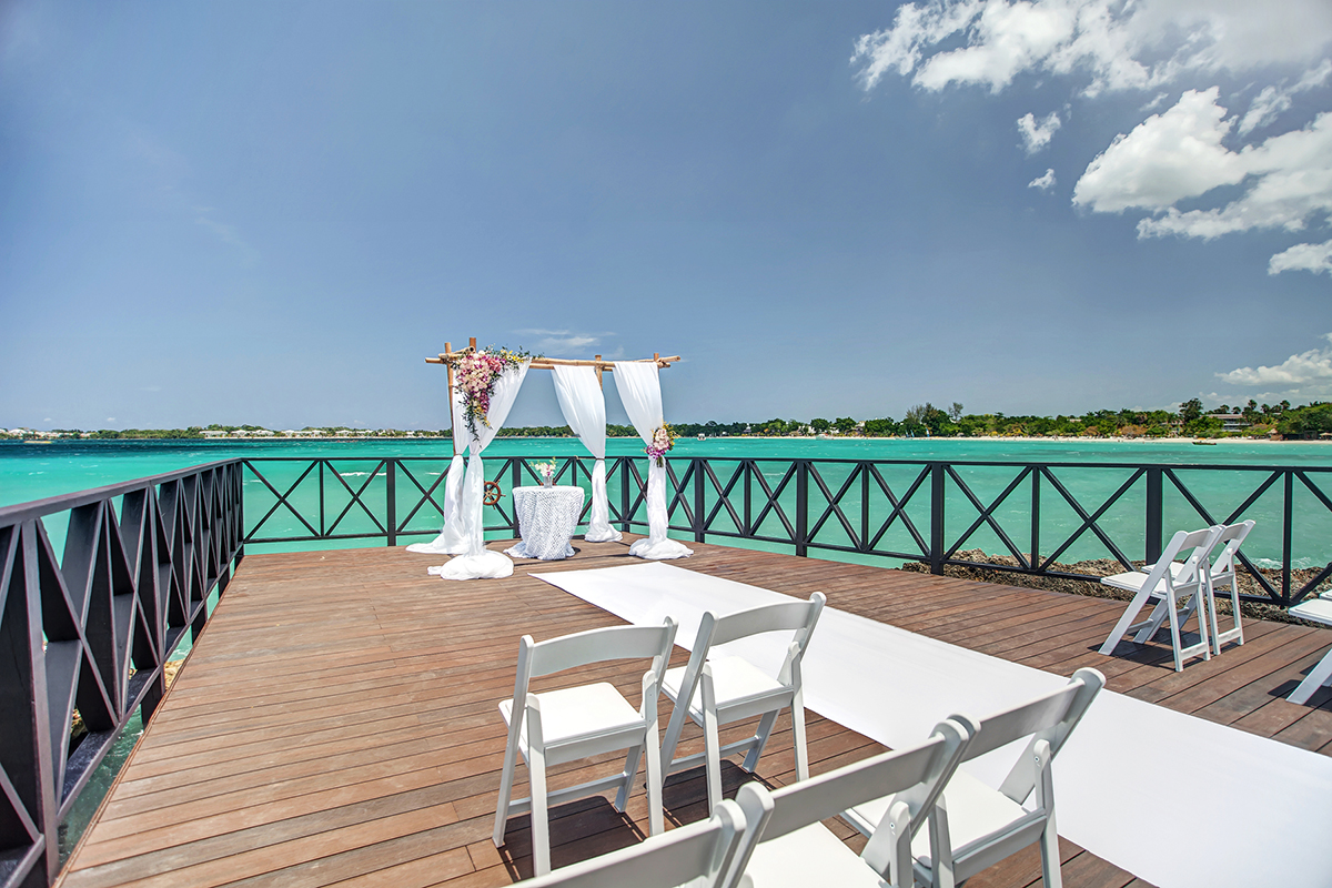 Oceanfront pier wedding ceremony in Jamaica